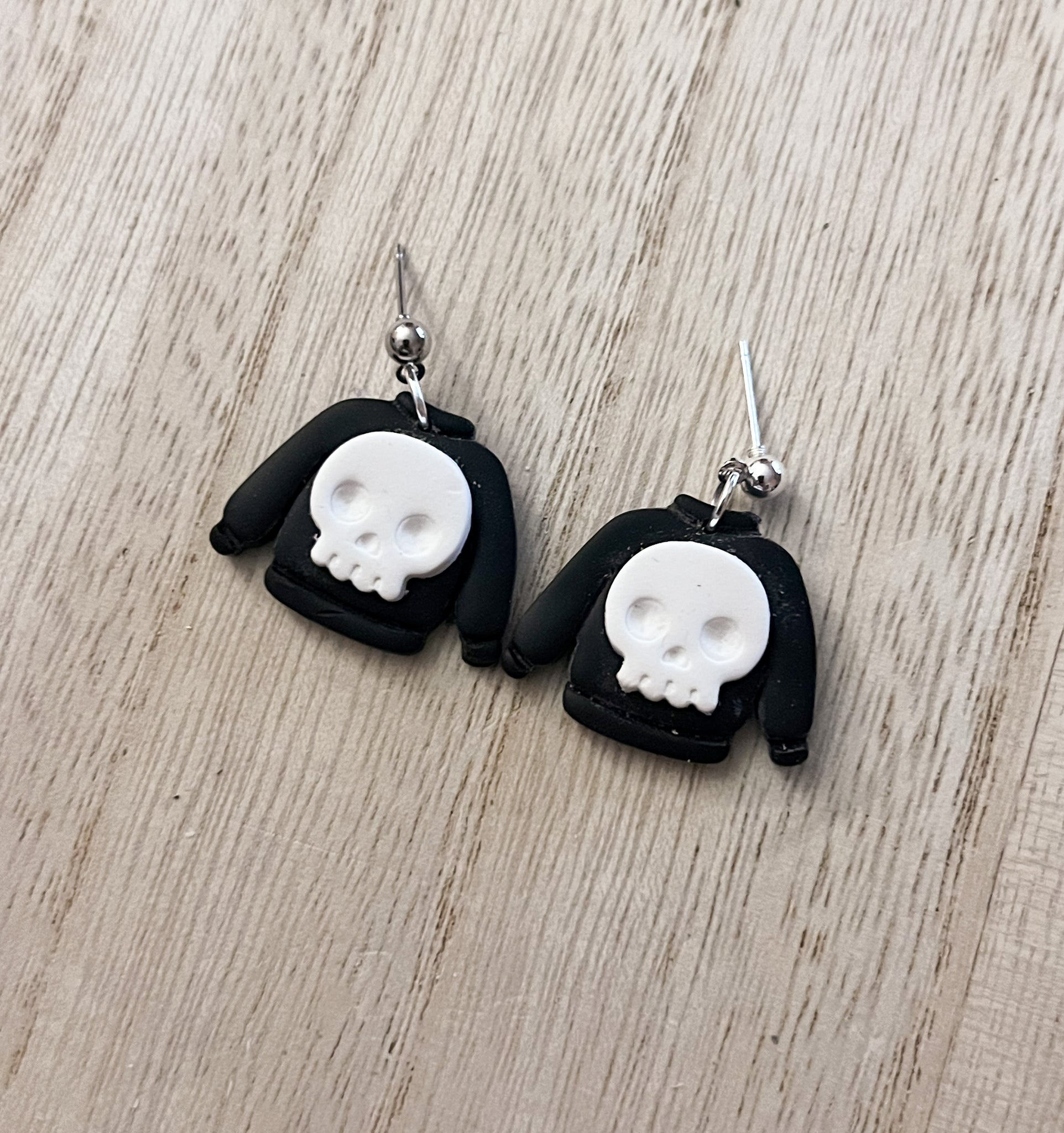 Skull sweater earrings