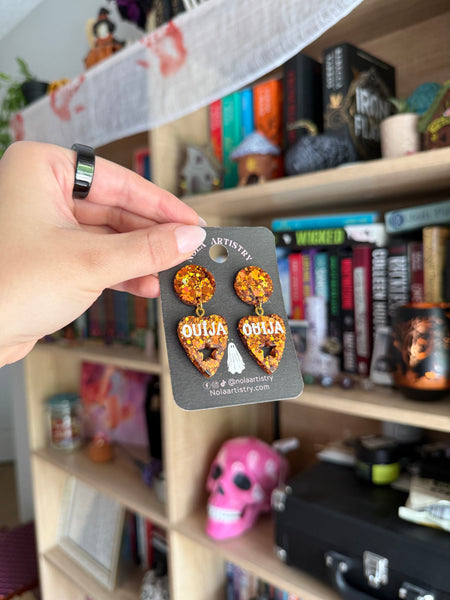 Orange ouija planchette earrings