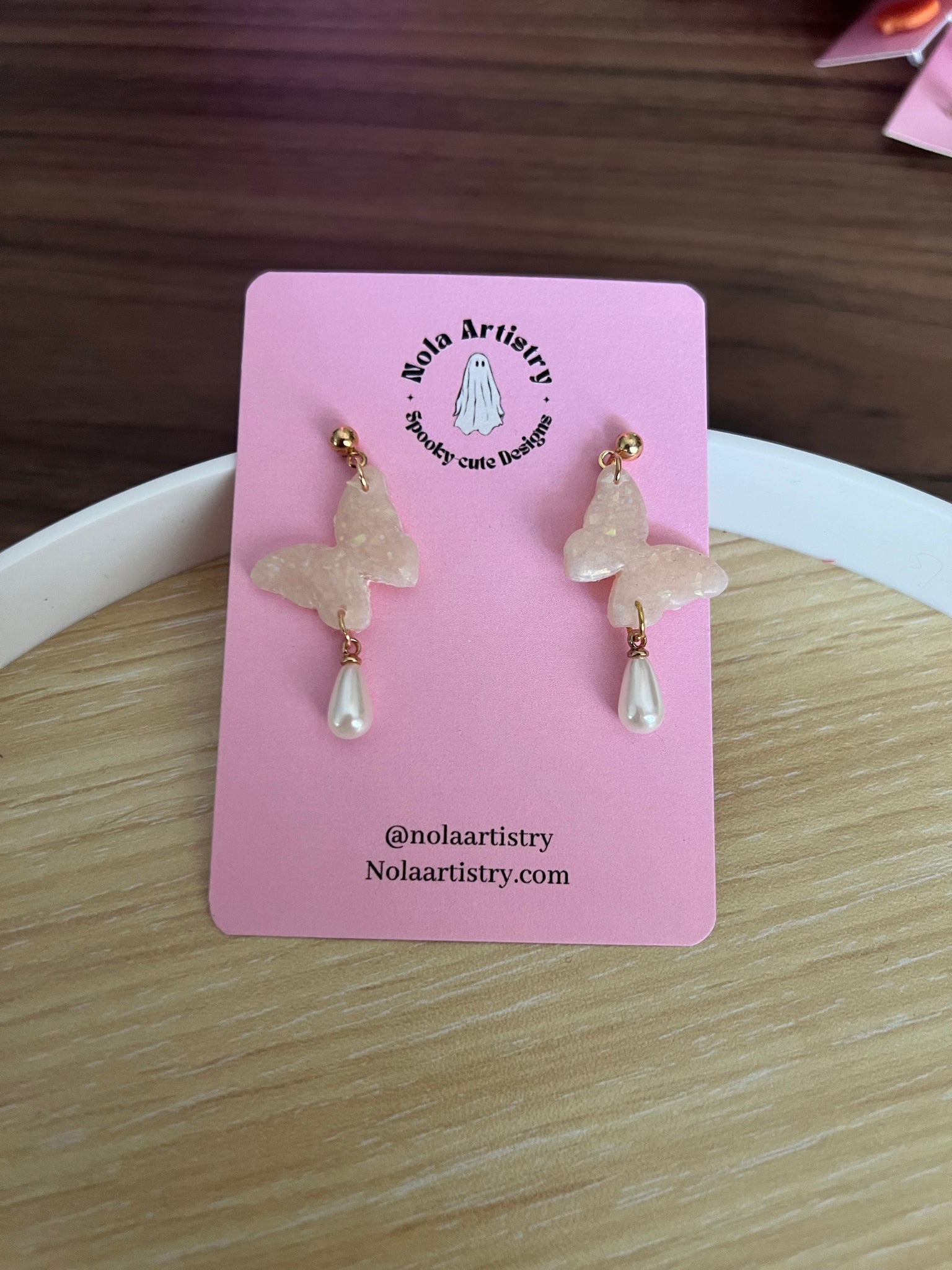 Butterfly pearl drop earrings